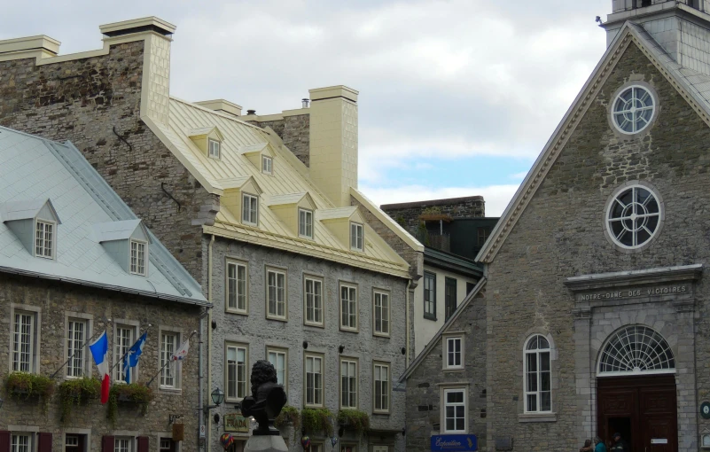 several large old buildings with a tower and clock