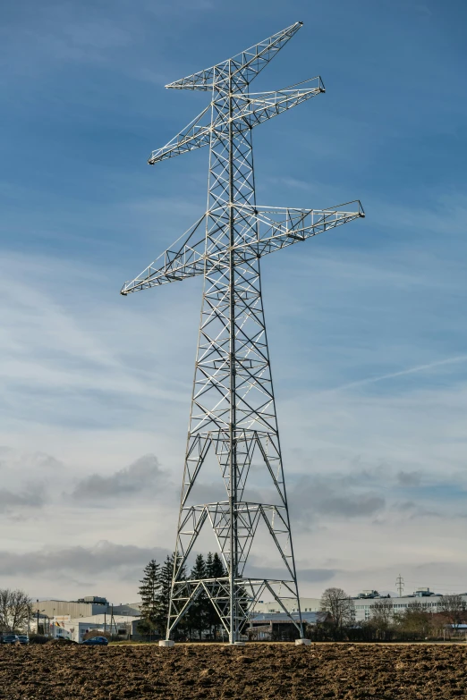 there is an electric tower next to the beach