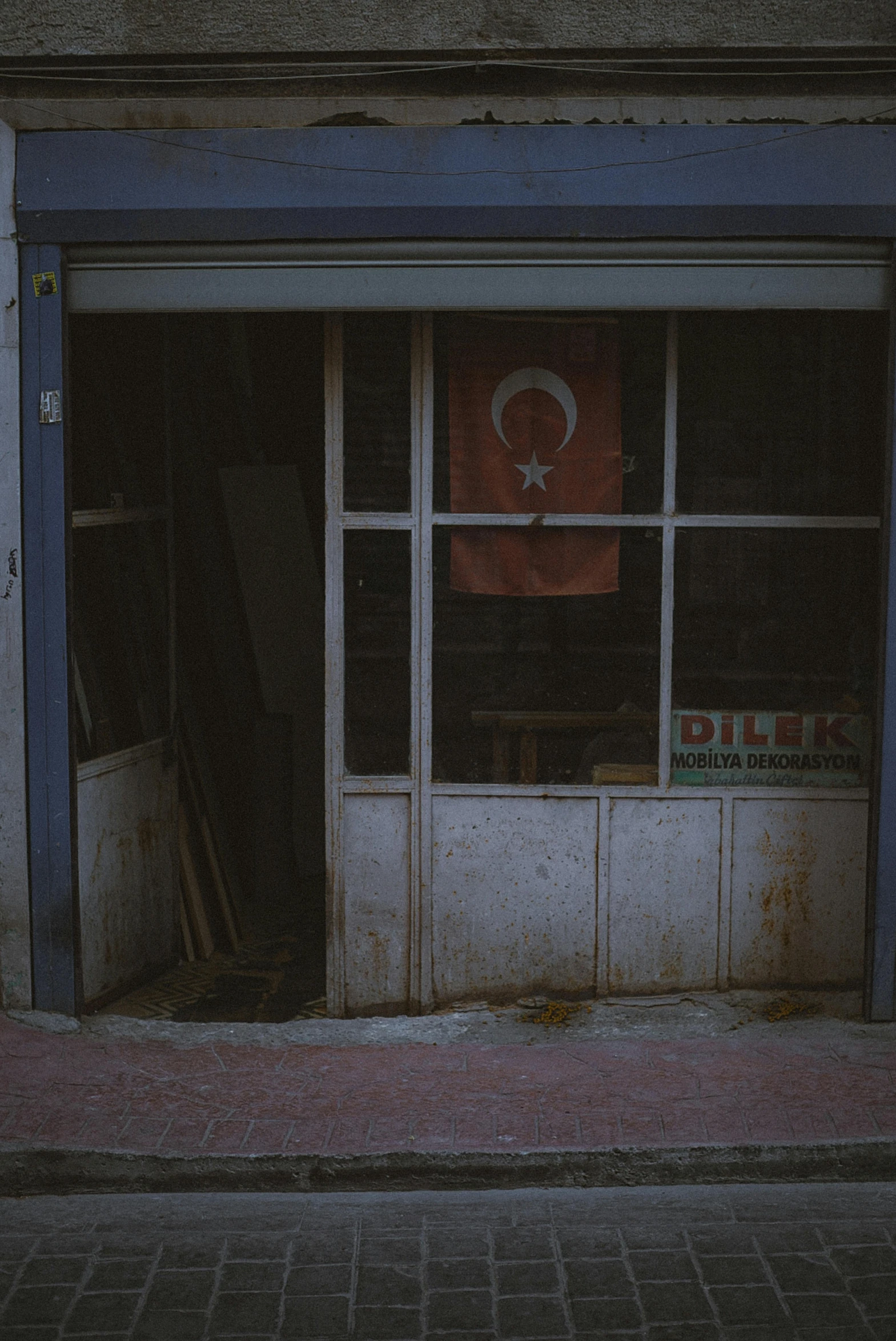 this is an empty building with a flag displayed outside