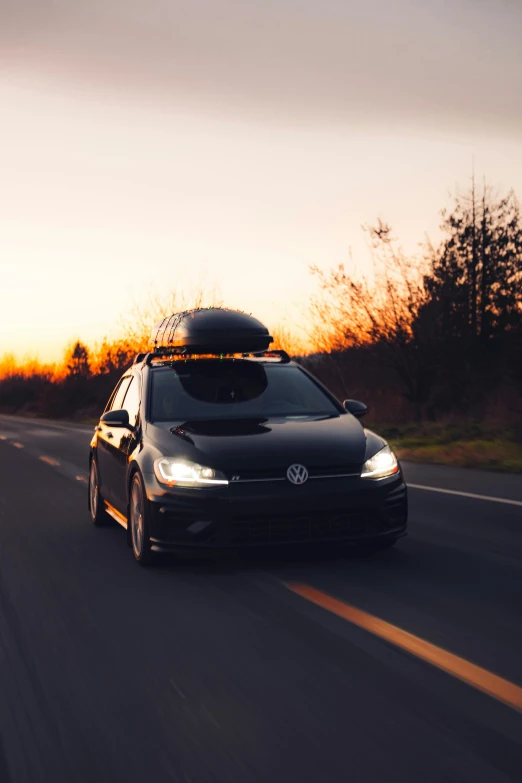 the vw golf gt with a surfboard on its roof