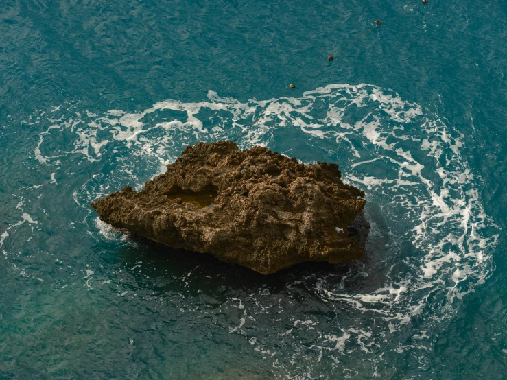 an image of a rocky cliff in the water