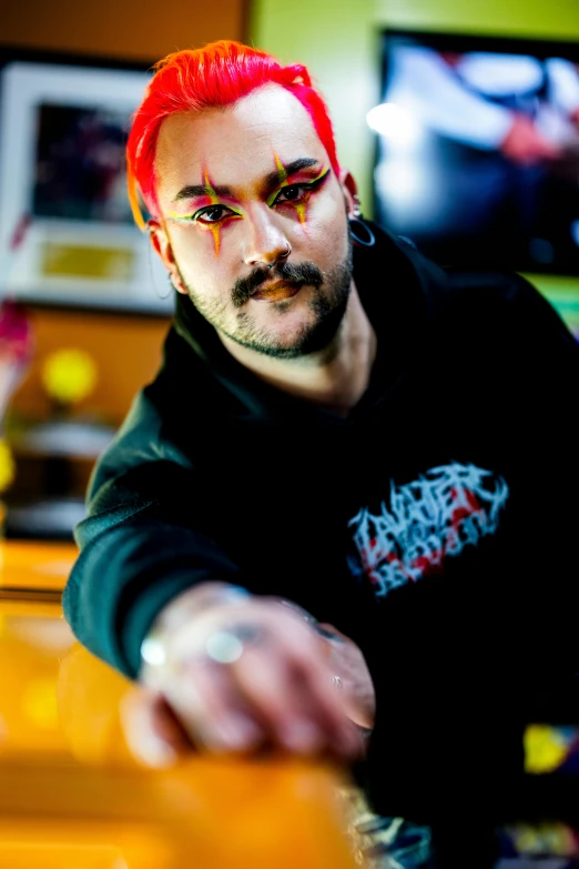 a man with red hair and black shirt