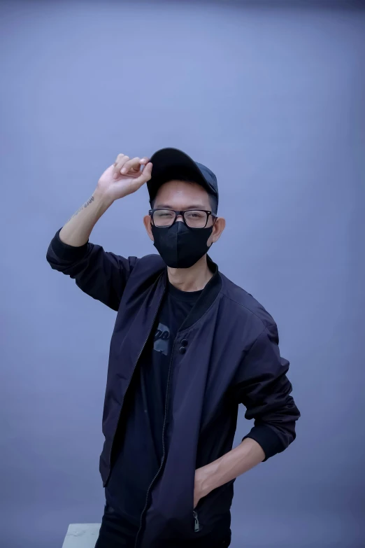 a man posing for a picture wearing a mask