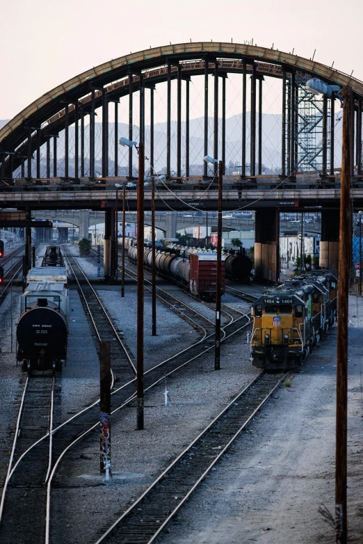 a large bridge that leads to a train yard