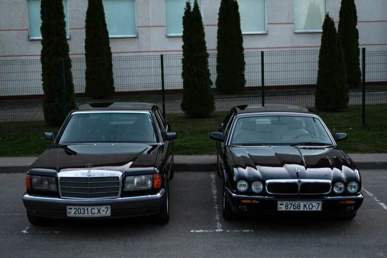 two parked cars with no toppers on them