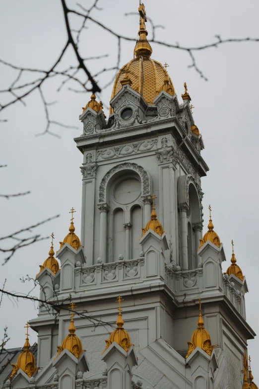 an elaborate building with gold dome on top