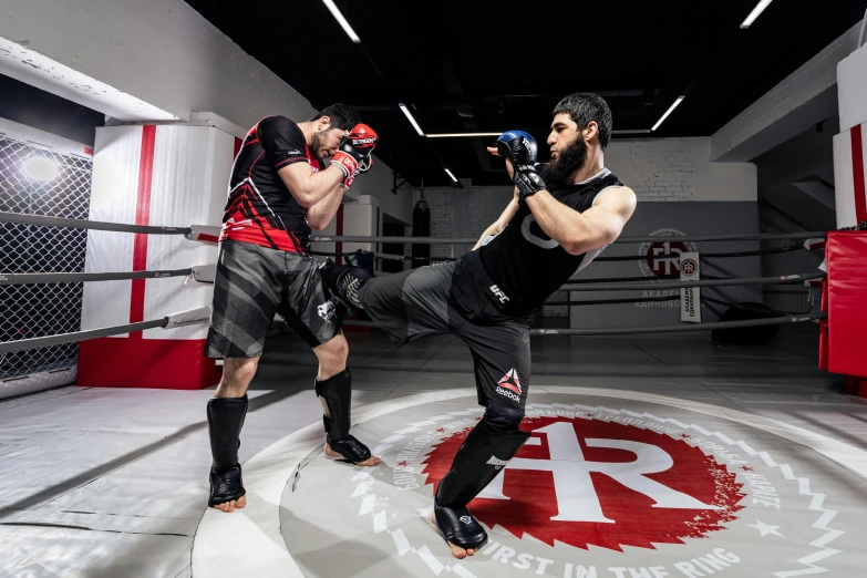 one man in fighting stance with a kickbox