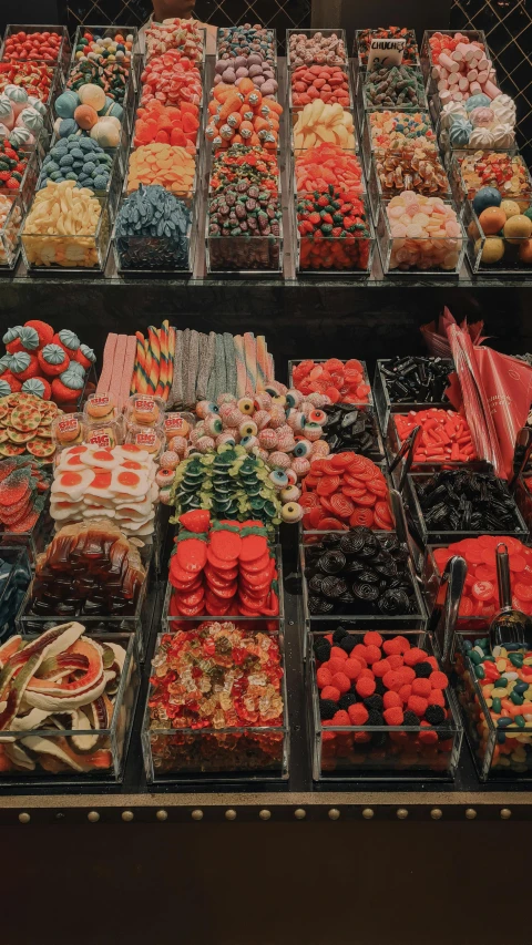 the display case holds many varieties of sweet foods