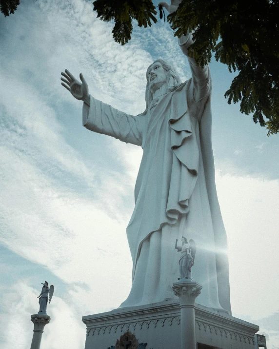 a statue with water spewing out of its hands