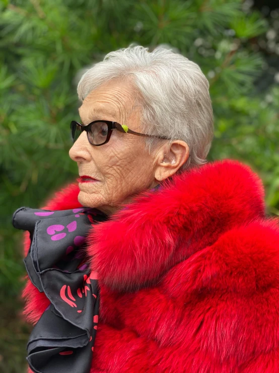 woman in red fur jacket looking off camera