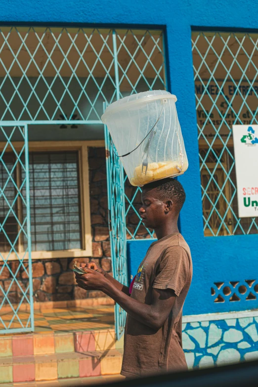 a man carrying a plastic bag full of things to go to work