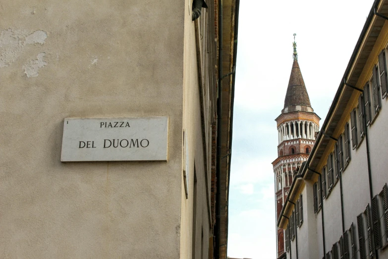 a sign on the wall indicates where the building is