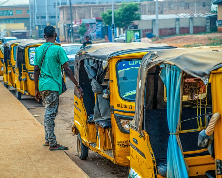 two rickshaws being used by the people who are traveling