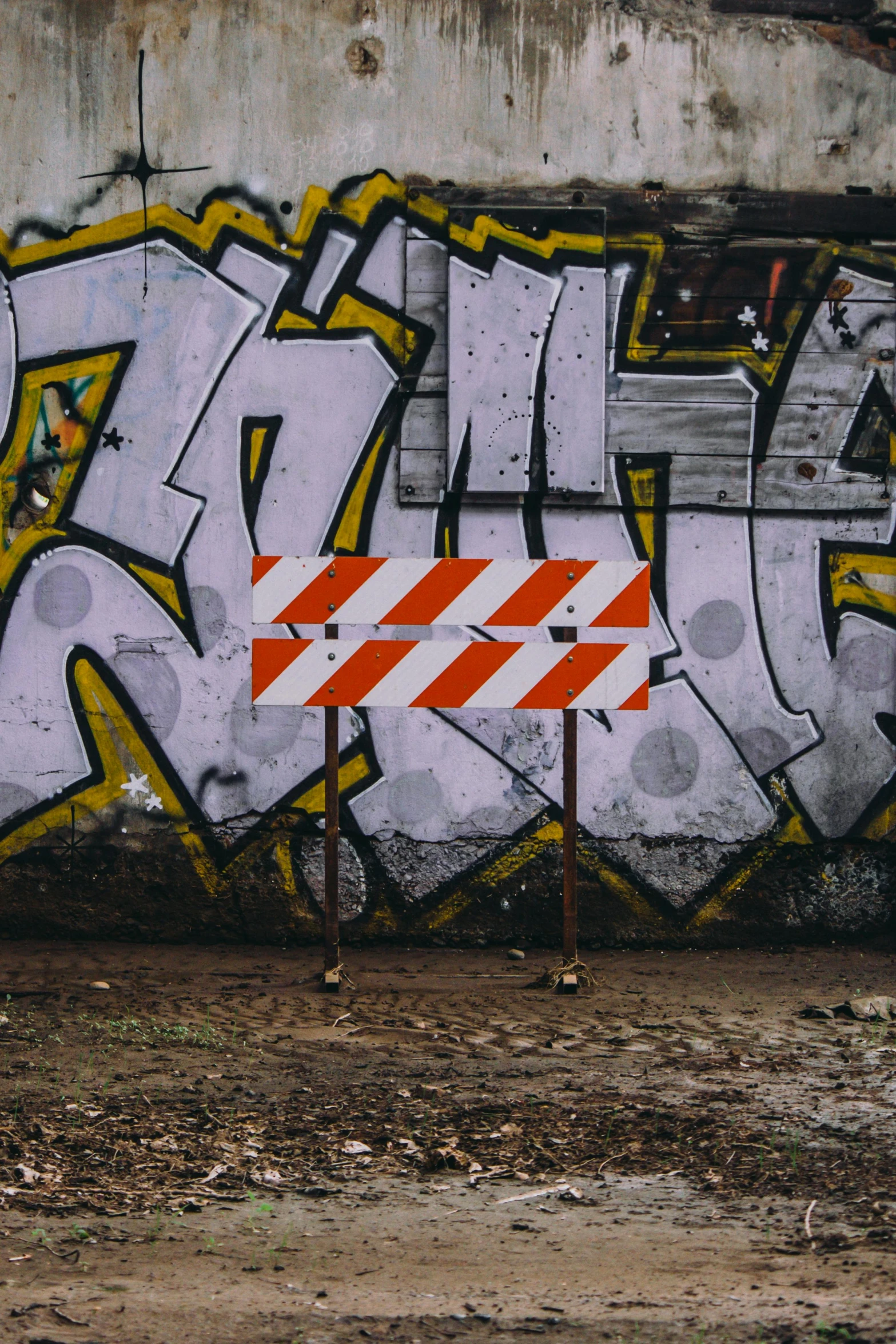 an old wall with some graffiti on it