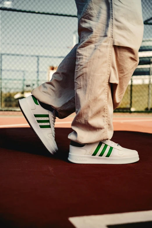 two people who are walking down a tennis court