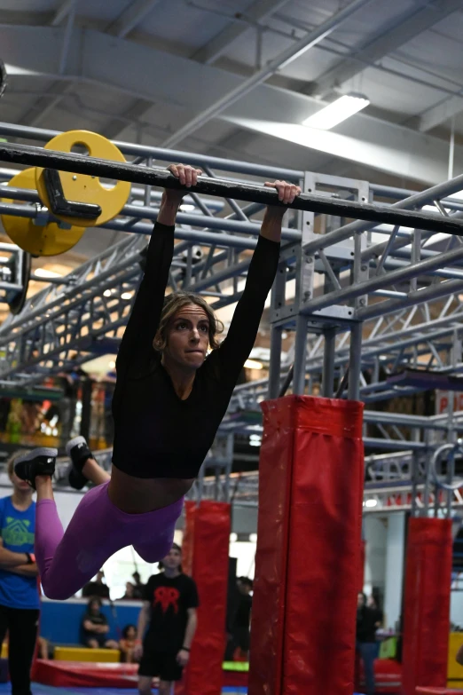 the woman is doing exercises on her bars