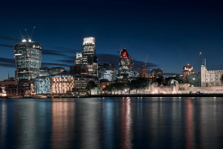 a view of the city from across the water at night