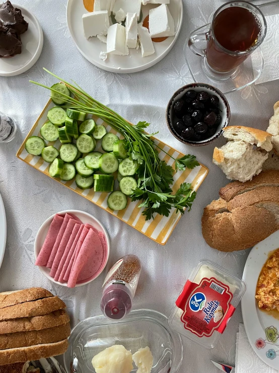 plates and breads with different food on them