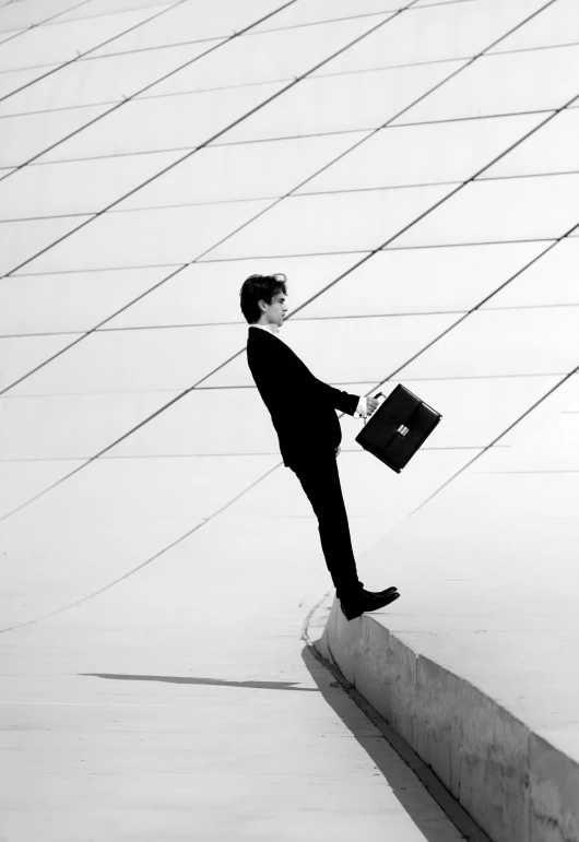 a man in a suit holding a briefcase