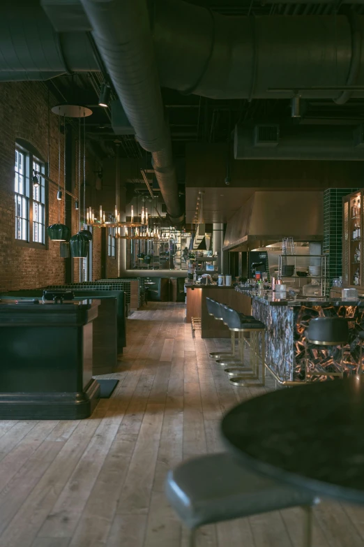 long view of a room in a bar with tables and chairs