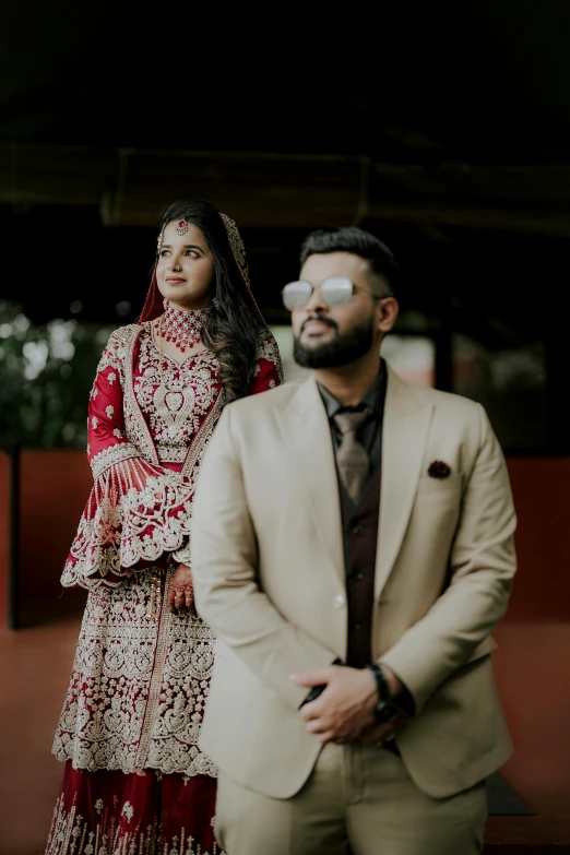 a man and woman dressed up with fancy outfits