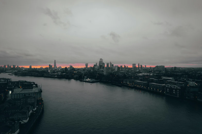 the city is on a cloudy day near water