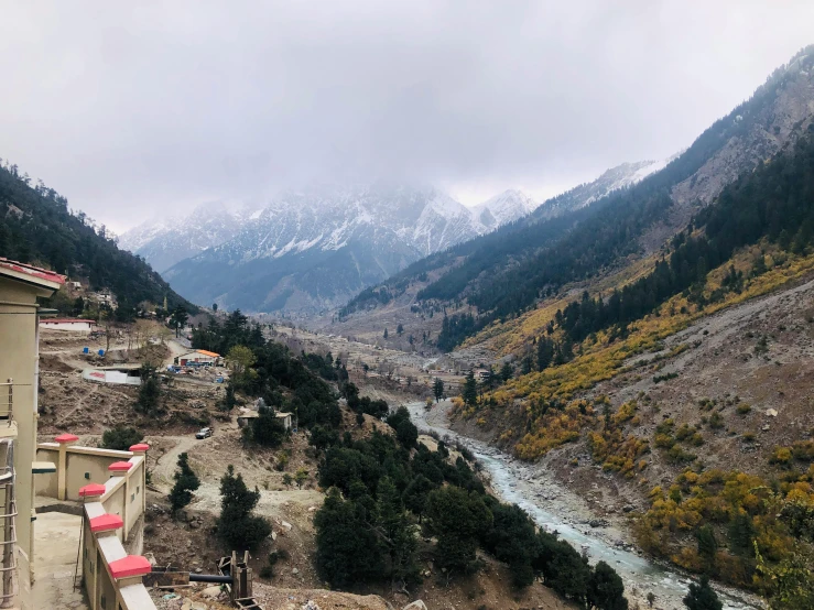 there is snow capped mountains surrounding a valley