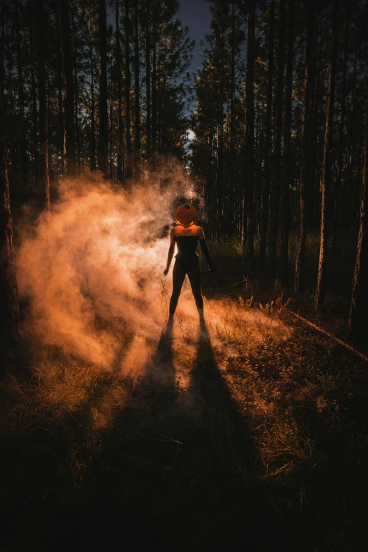 a person walking on a path with a bunch of dust in it