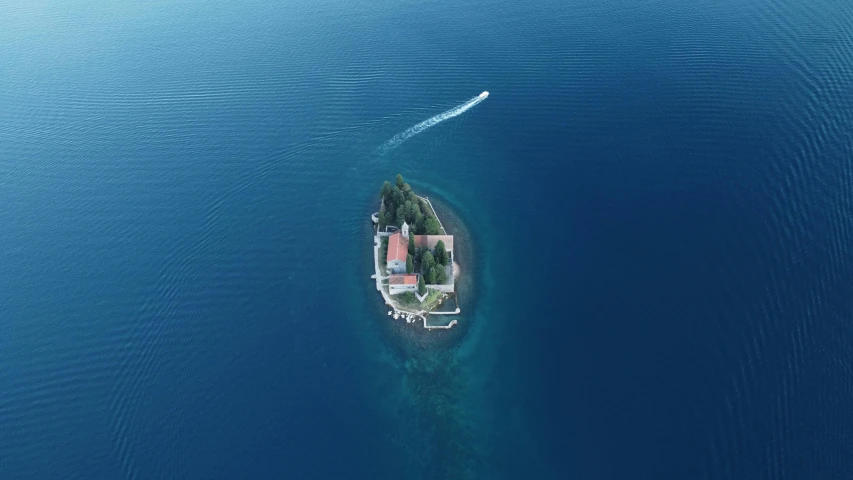 an island and some houses are seen from a bird - eye view