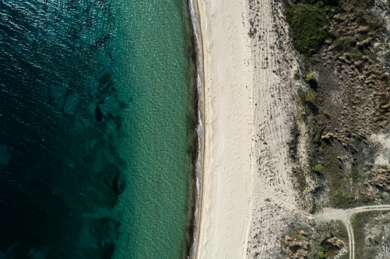 a beach with a path going across the water