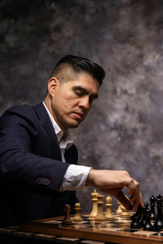 an image of man playing chess on a table