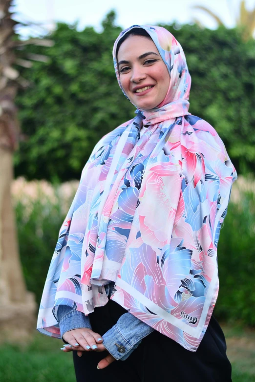 a woman in a colorful hijab and head scarf