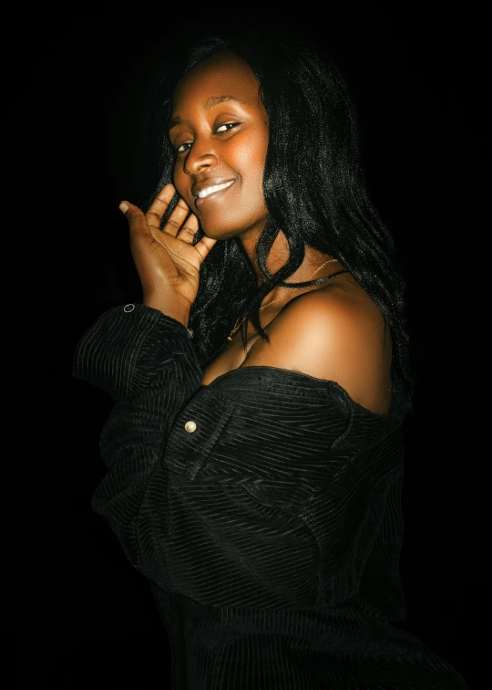 a woman in a black shirt talking on her phone