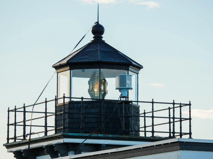 a close up of a light house on top of a building