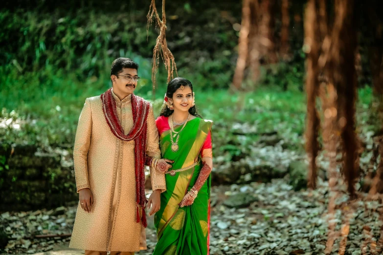 a couple poses for a po in their wedding clothes