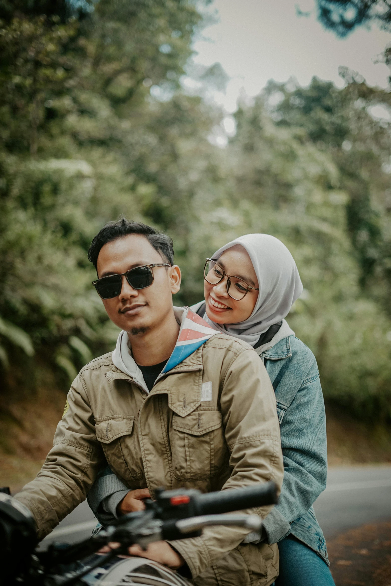 an image of a man on a motorcycle with a lady