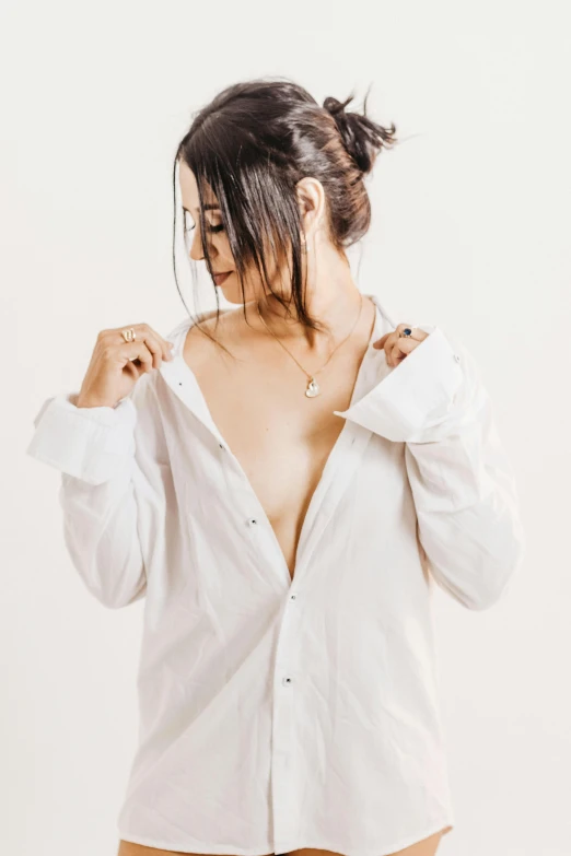 the back of a woman wearing a white blouse