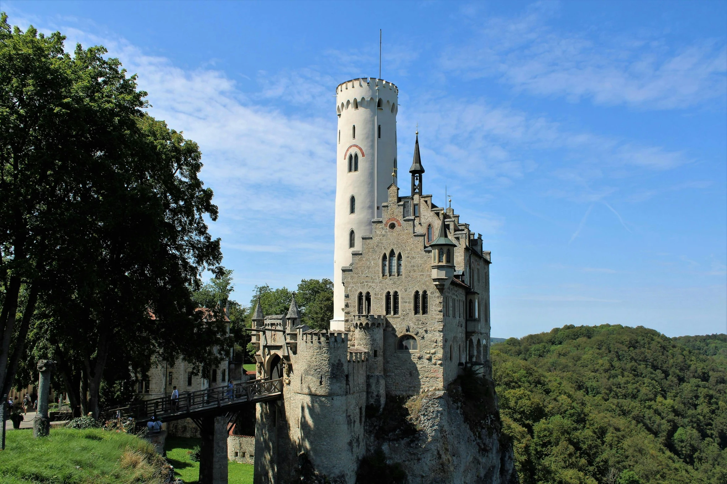 the view from below of an old castle on a mountain