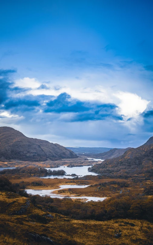 a picture taken from the top of a mountain looking at the view over lake and mountains