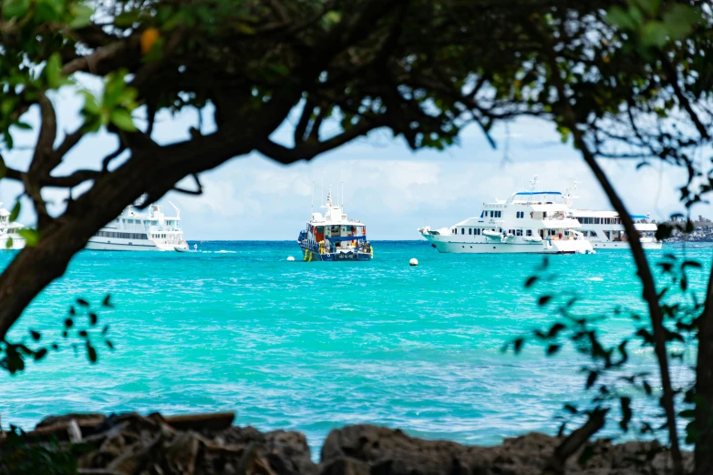 several boats sitting in the blue water