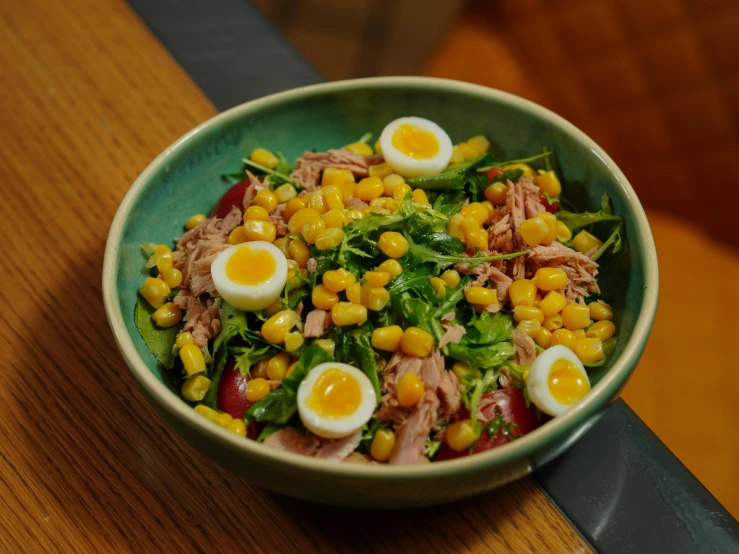 a close up of a bowl of food on a table