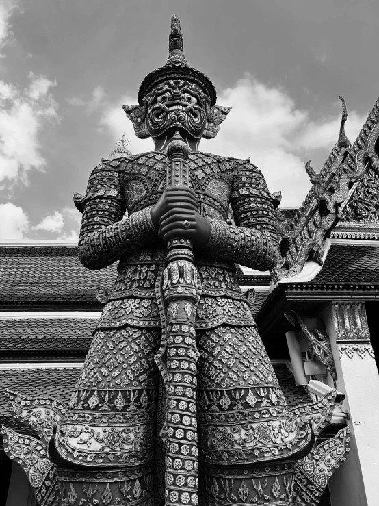 a statue is shown in front of a building