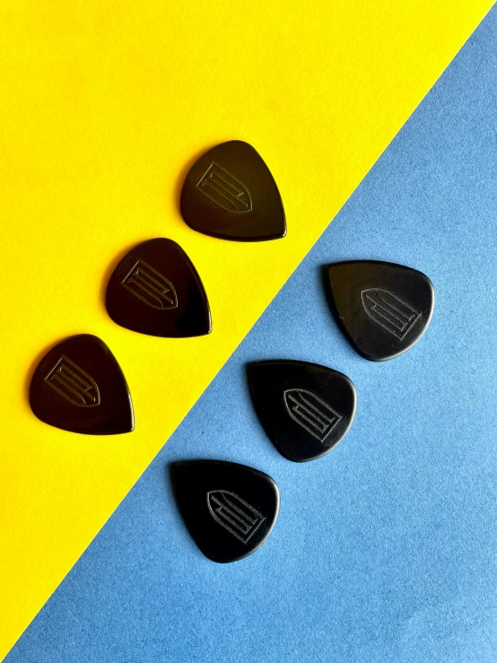 four picks on blue, yellow and orange background