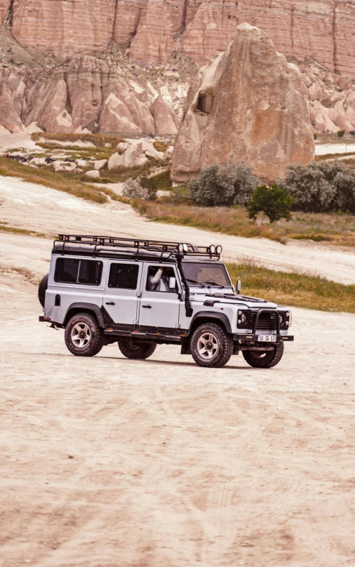 two jeeps parked in an off road area