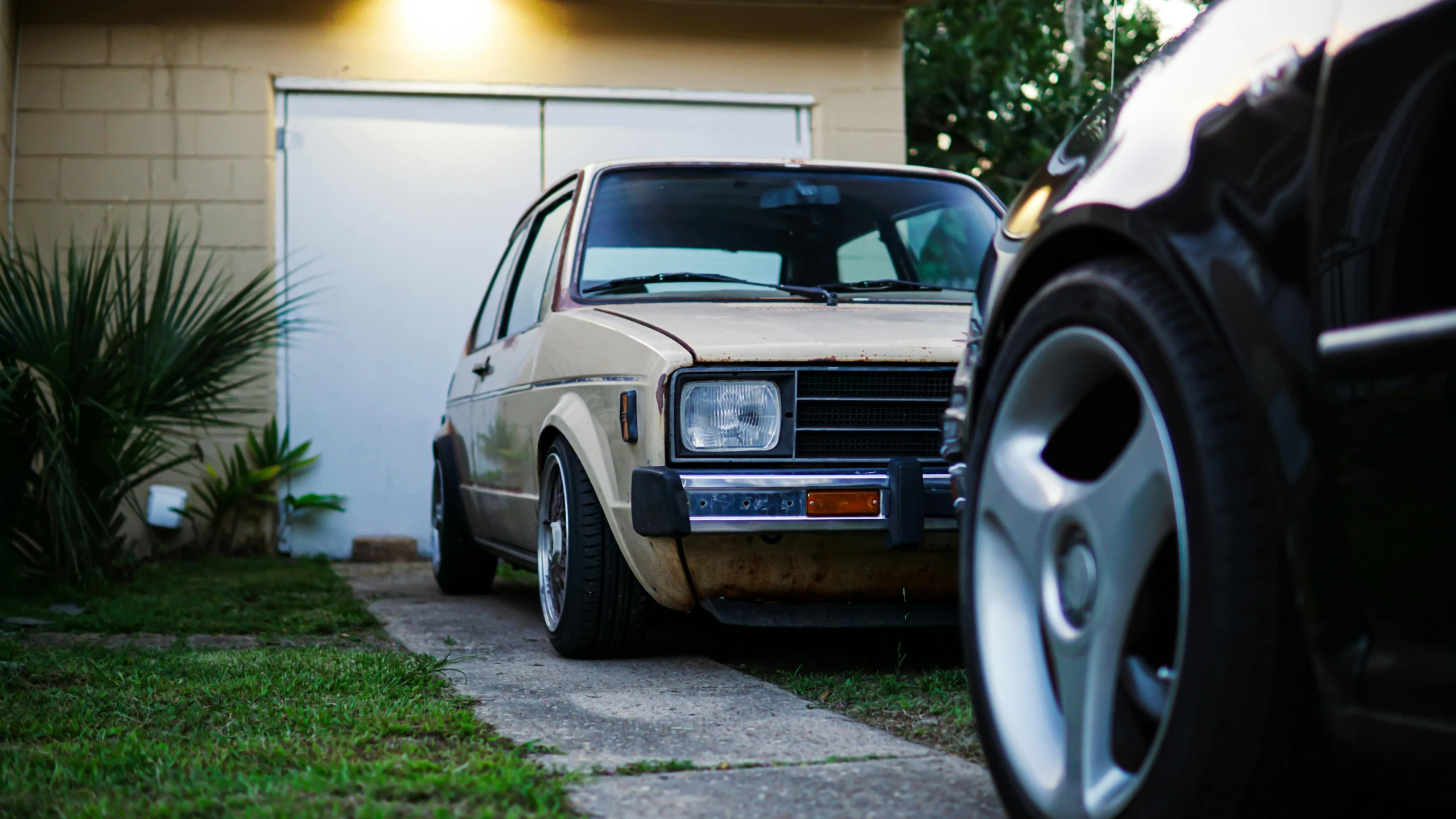 a car sitting parked next to a small house