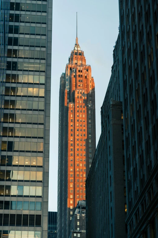 some tall buildings and one has a clock tower