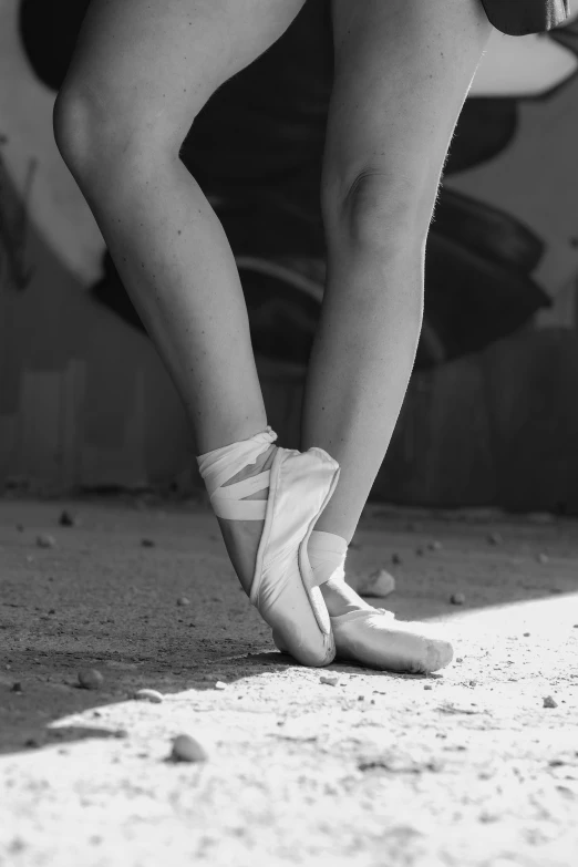 the legs of two ballerinas with bandaged ankles
