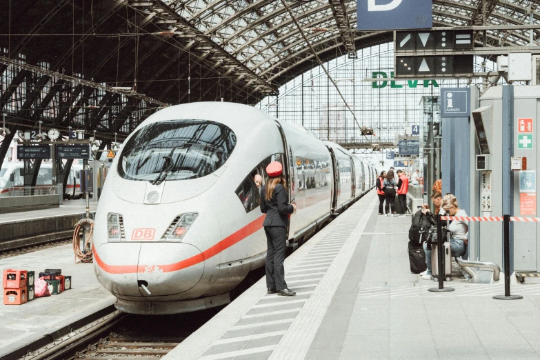 there are many people waiting for a train