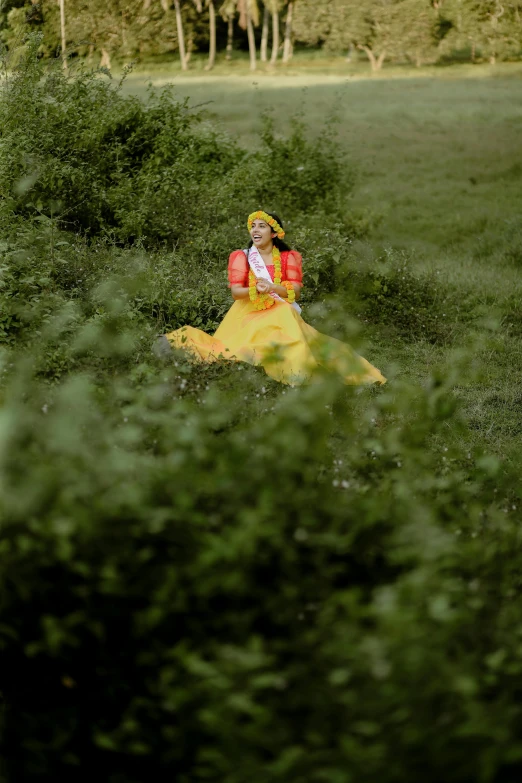 woman in yellow dress sitting on yellow couch