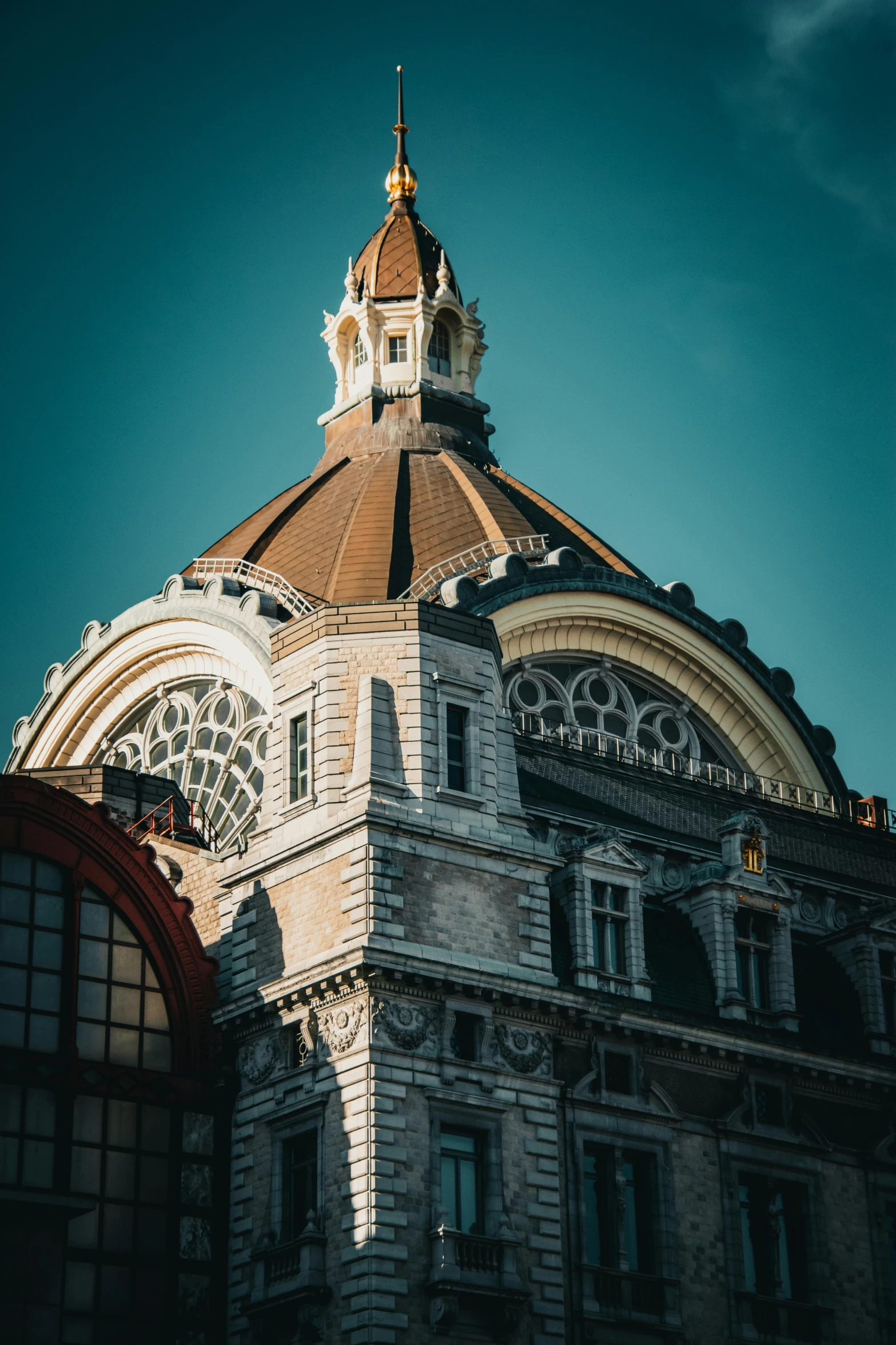 a building with a golden dome and a clock on the roof